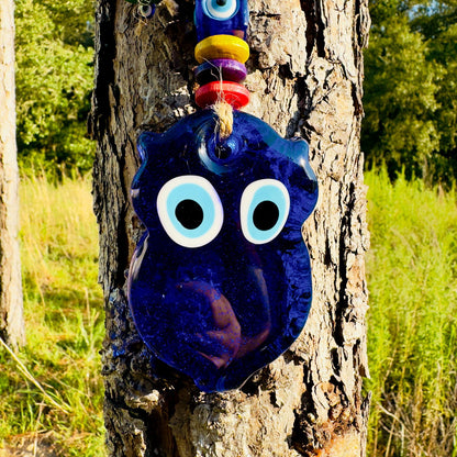 Mini blue owl wall hanging with large circular evil-eye eyes and multicolor beads