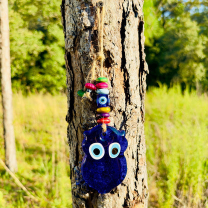 Mini blue owl wall hanging with multicolor wood beads and evil-eye eye details