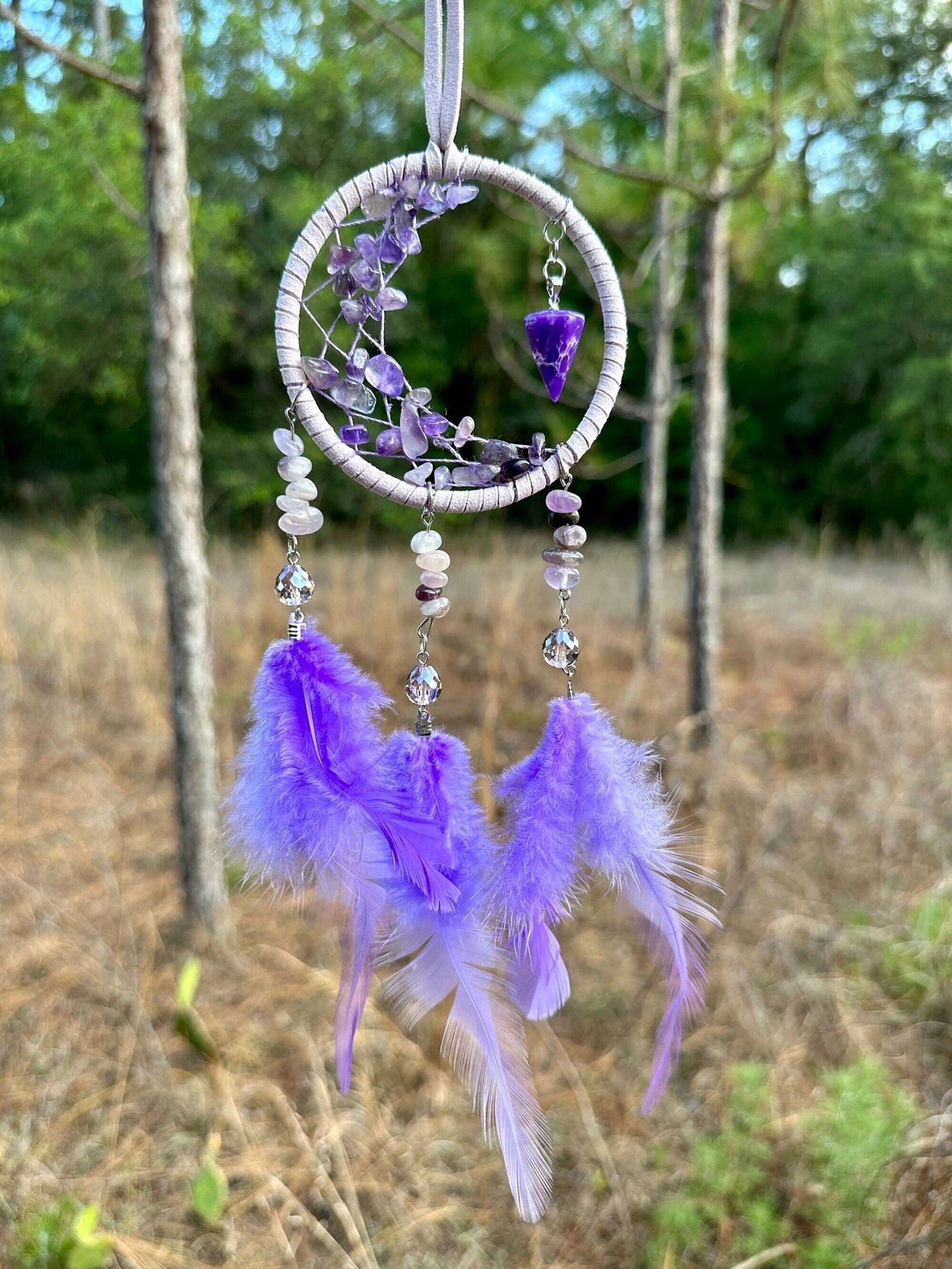 Purple dreamcatcher hoop with dangling purple feathers and crystal bead charms