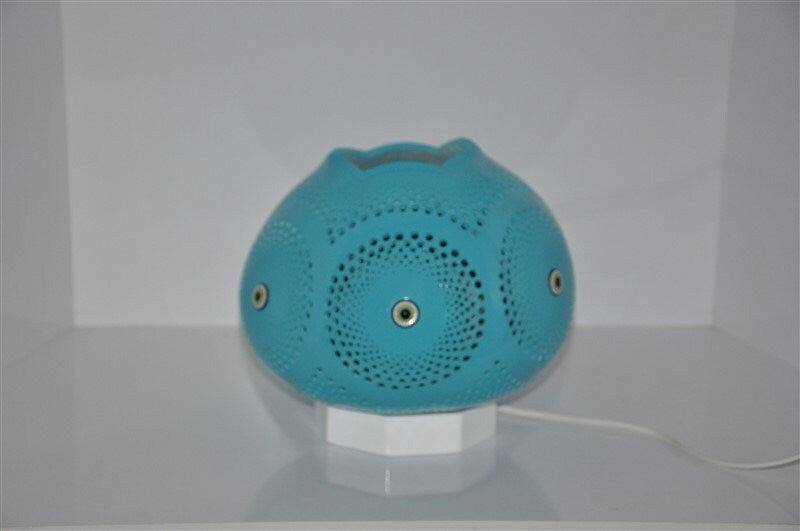 Turquoise evil eye mosaic table lamp with dotted circular design on base