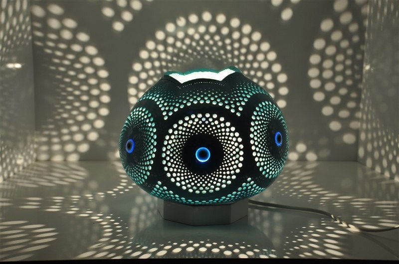 Turquoise mosaic table lamp with circular evil eye pattern and dotted details