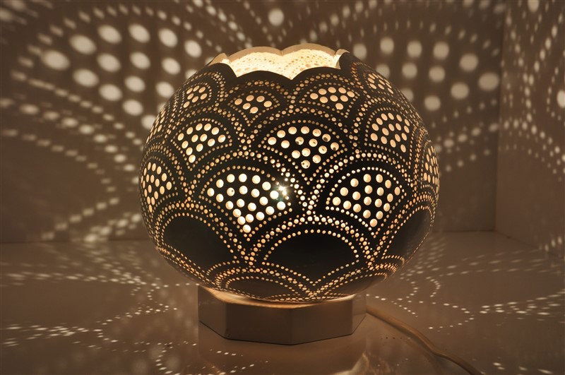 Moroccan mosaic table lamp with scalloped gourd shade, dark gold and black pierced pattern.