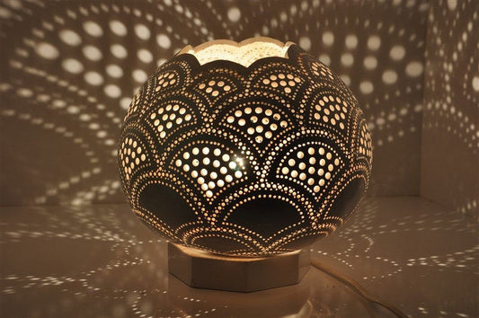 Moroccan mosaic table lamp with scalloped gourd shade, dark gold and black pierced pattern.