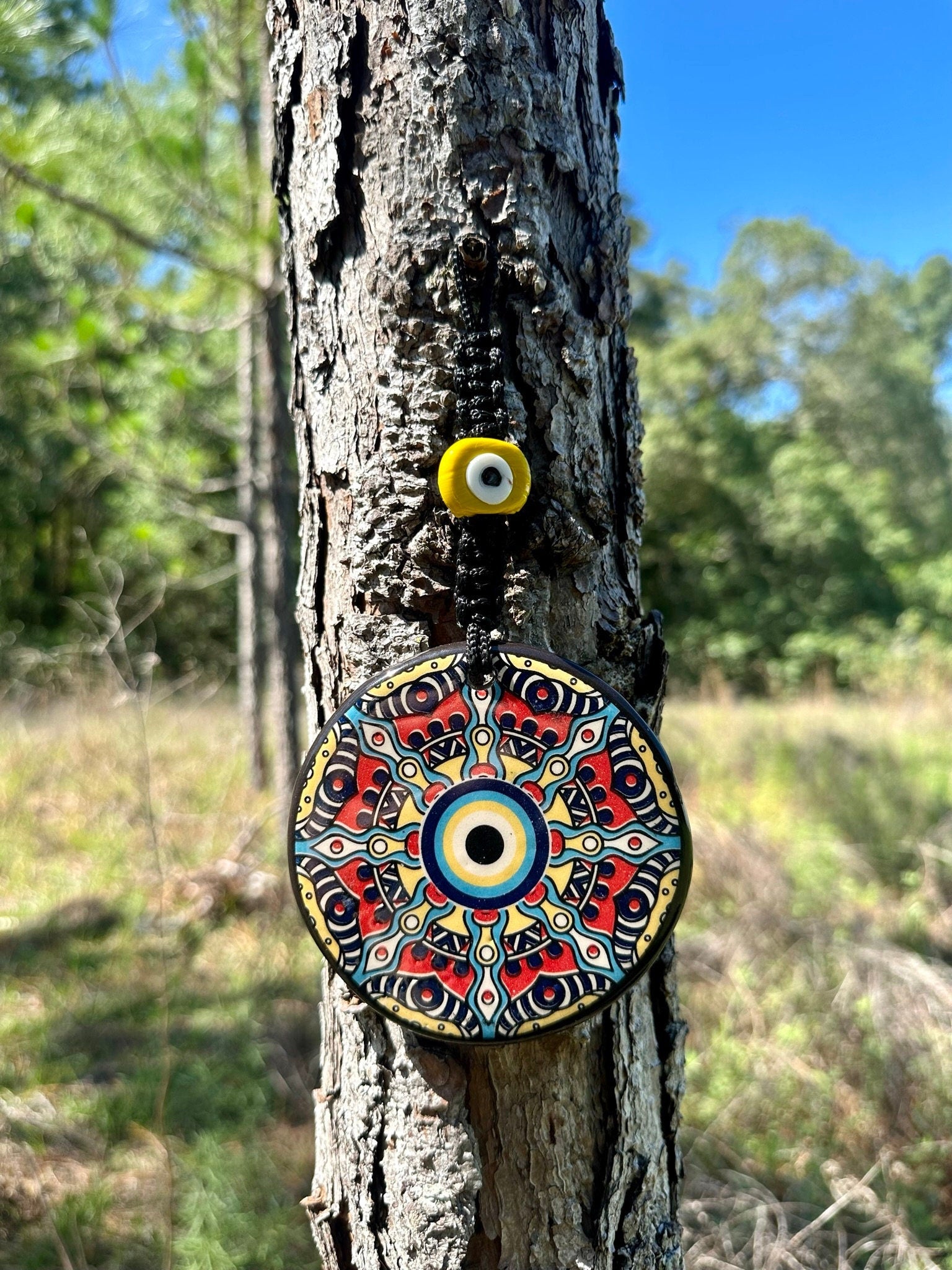 Evil eye ceramic wall hanging with colorful mandala pattern