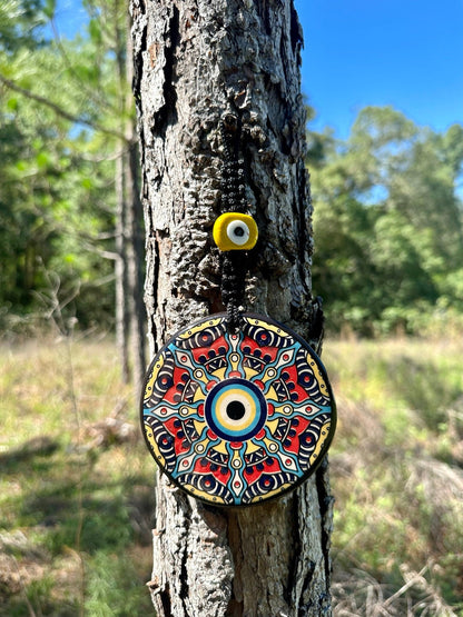 Evil eye ceramic wall hanging with colorful mandala pattern