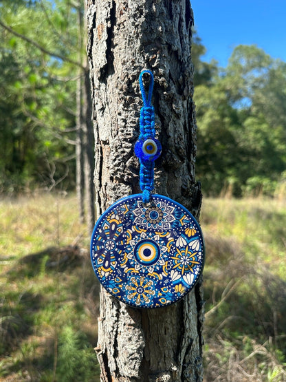 Blue ceramic evil eye wall hanging, round nazar charm with beaded cord