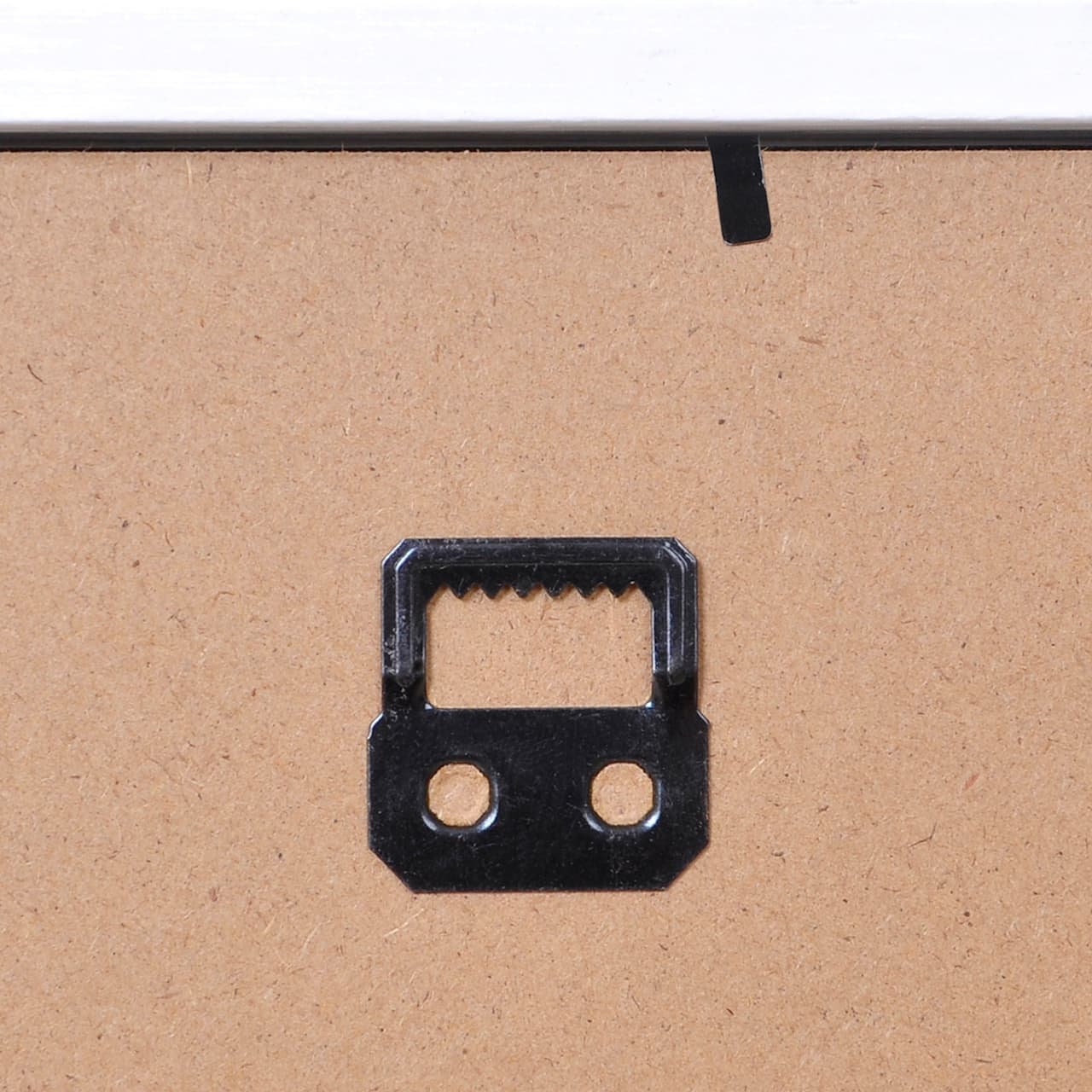 Shadow box backing board with black metal hanger loop in center